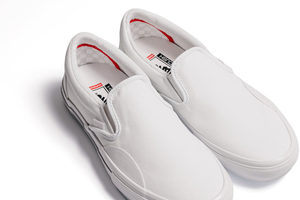 Vans slip on trainers in white deals